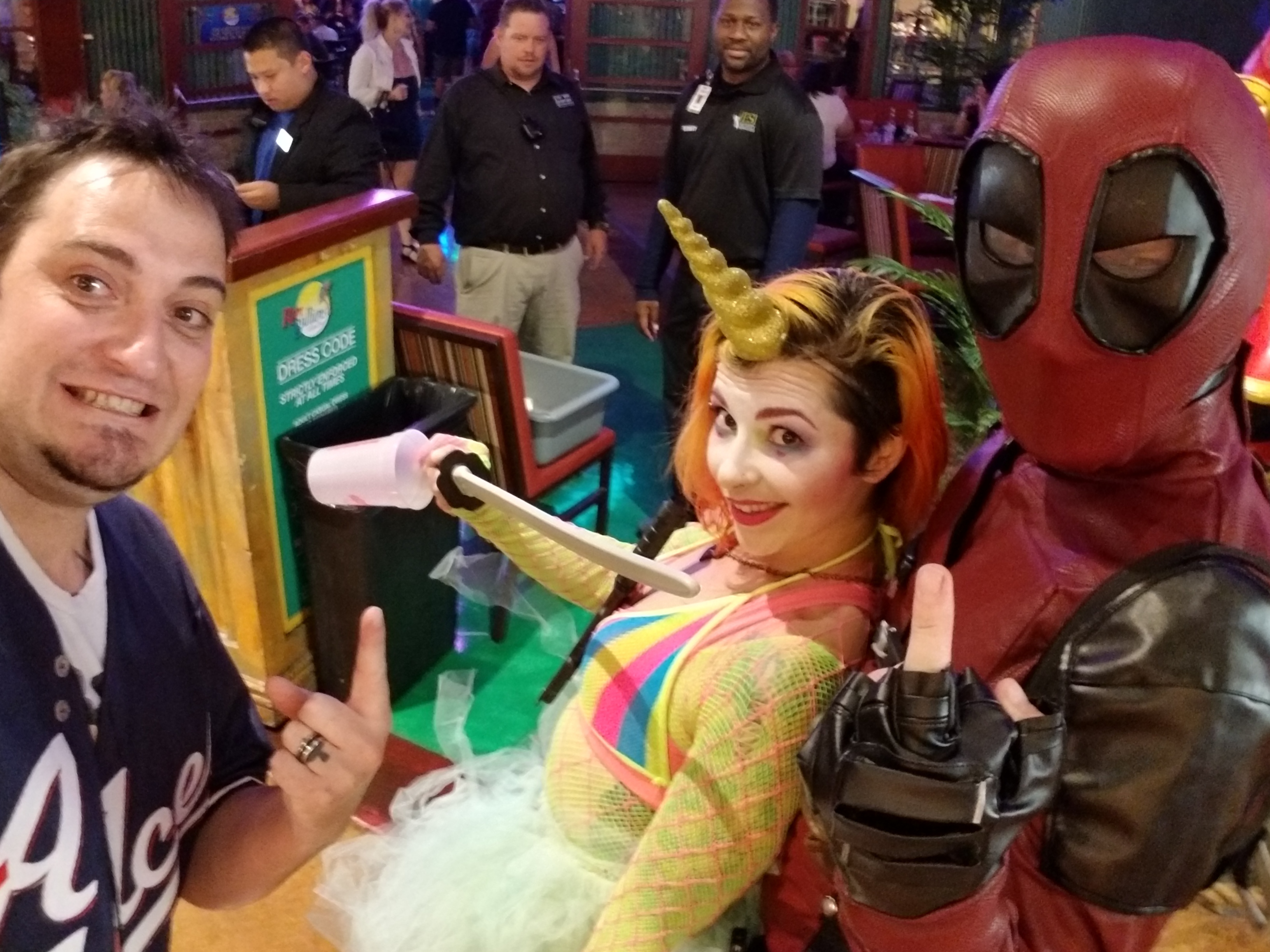 Kronik hosting the Rumbullions costume contest with unicorn and Deadpool contestants