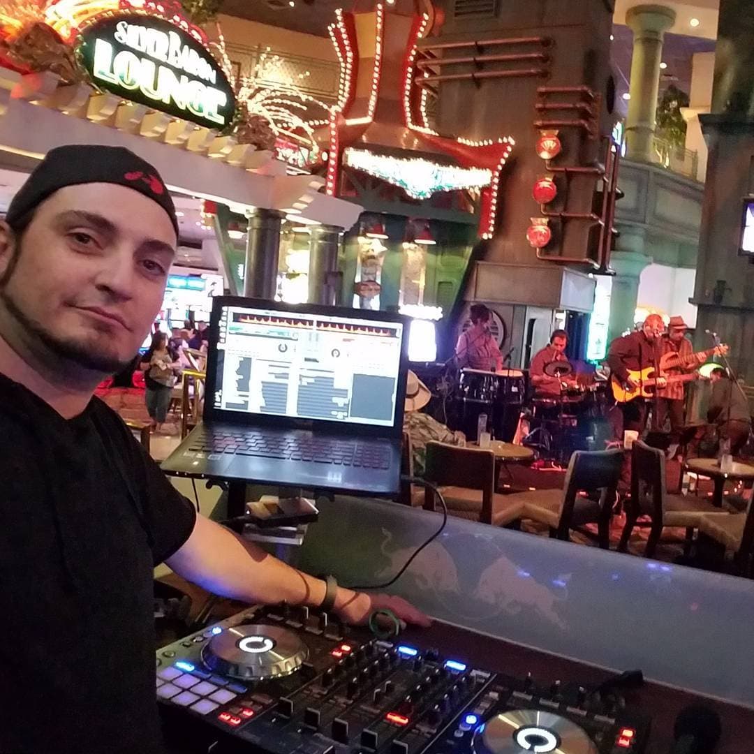 Kronik at the DJ controller and laptop with a live band at Silver Baron Lounge